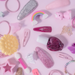 A collection of colorful hair accessories for girls, including bows, headbands, and clips, displayed on a white background.