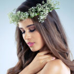 Studio shot of a beautiful young woman with holiday and festival hairstyles.